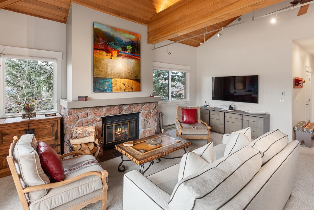 Living room fireplace and vaulted ceiling